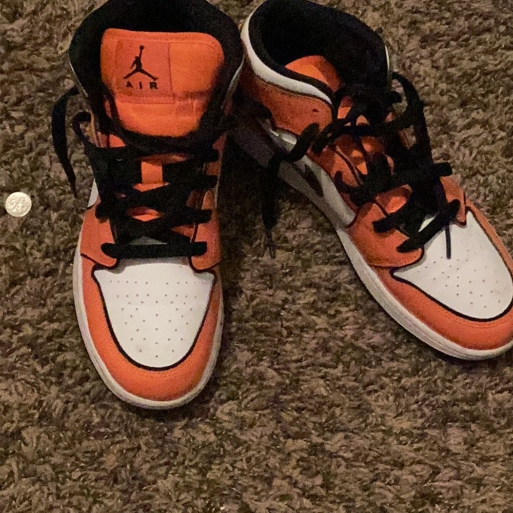 Orange black and white air Jordan’s